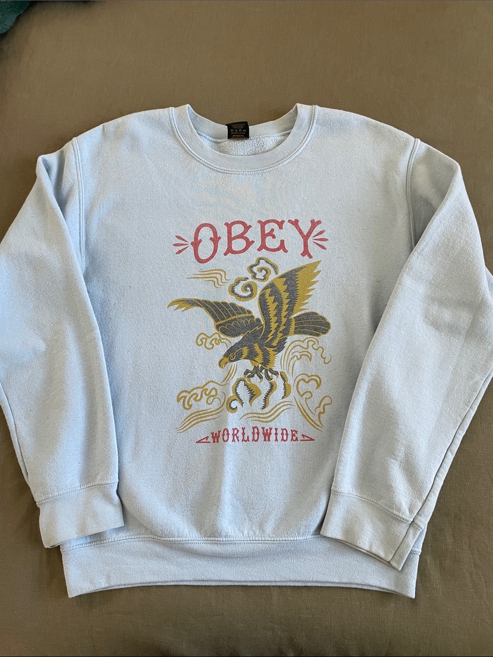 Obey women’s Light Blue Graphic Crewneck Sweatshirt